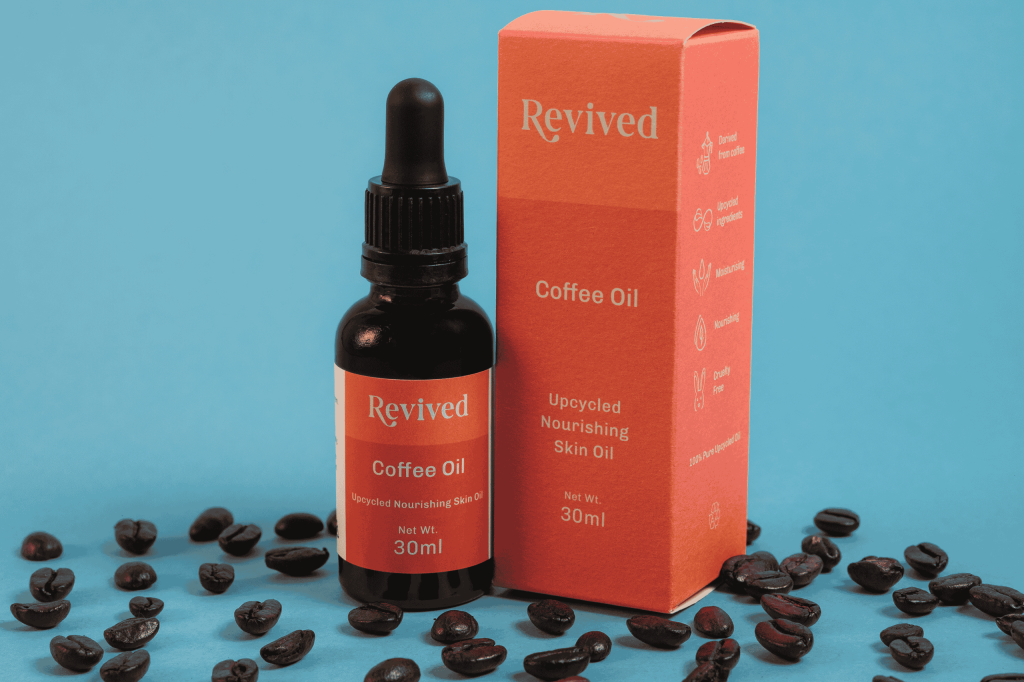 image showing coffee oil bottle next to box
